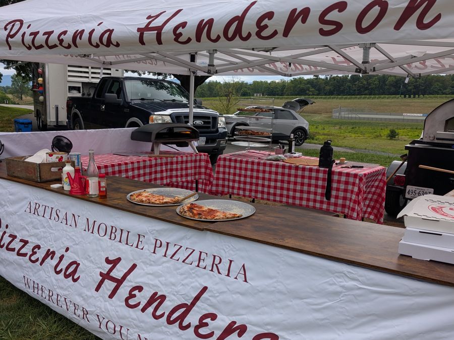Pizzeria Henderson pop-up at a vineyard with pizzas on the serving counter