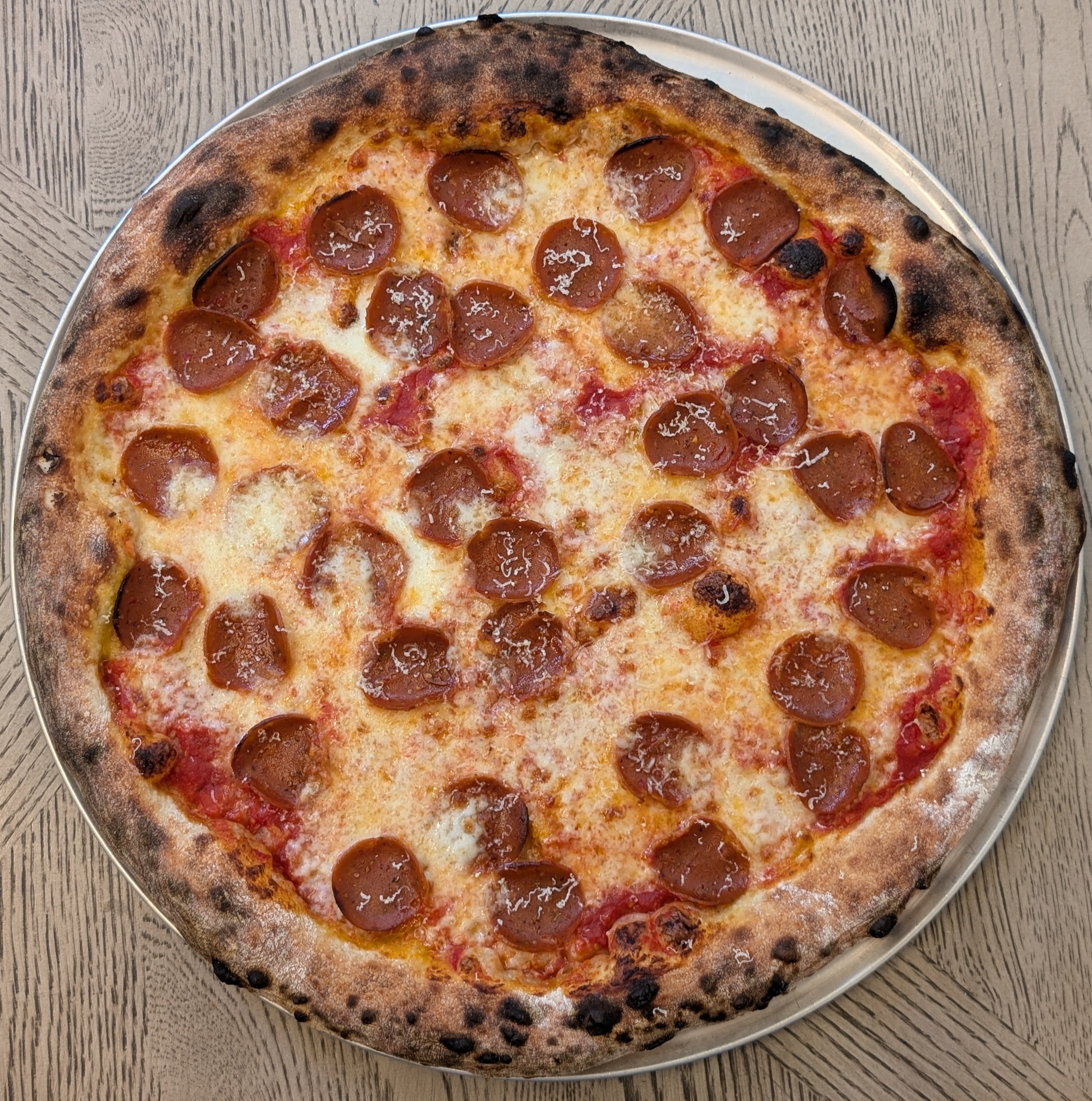 Pepperoni pizza on wooden table